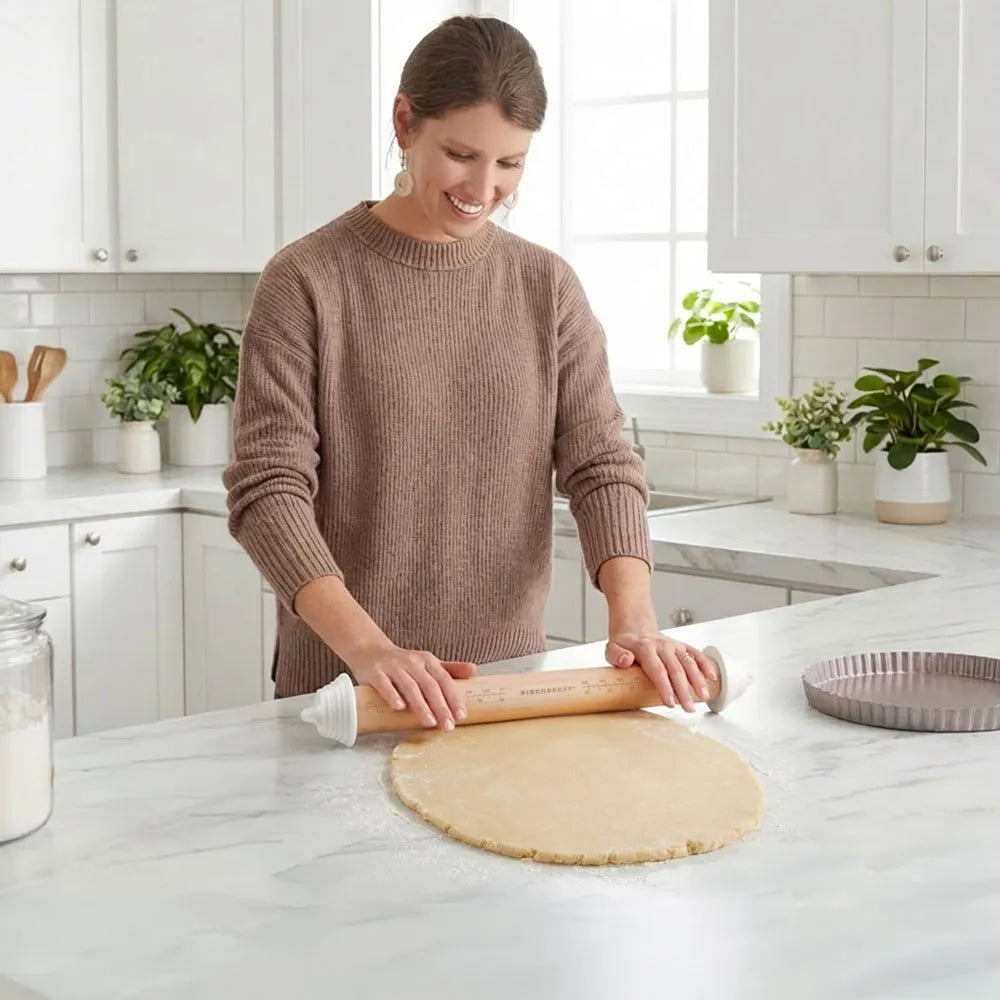 Woman rolling dough with the Birchberry Adjustable Rolling Pin